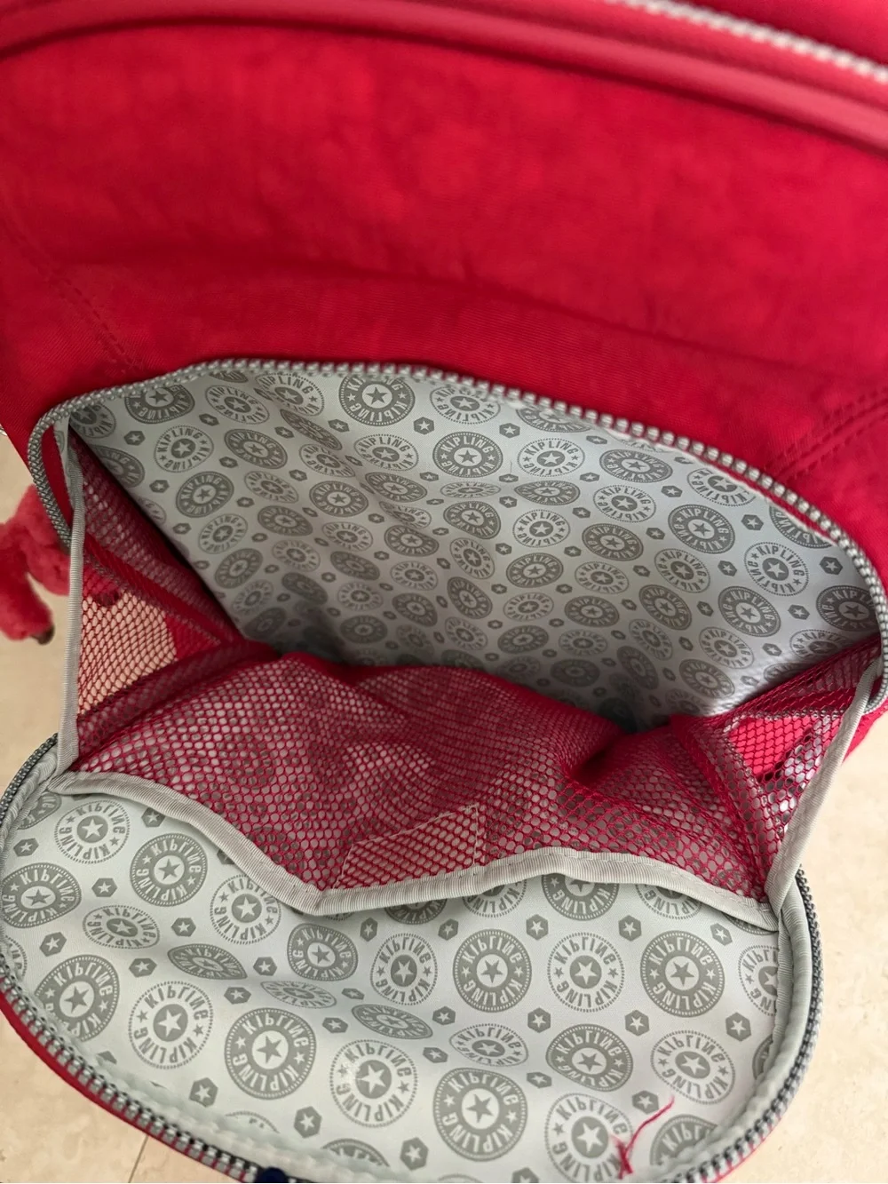 Kipling Bright Red Rolling Backpack with Monkey Charm
